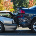 Auto accident involving two cars on a city street