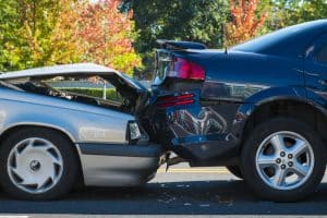 Auto accident involving two cars on a city street