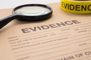 magnifying glass and evidence bag for detective and crime scene investigation
