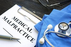 Medical malpractice. Medical suit, stethoscope and documents.