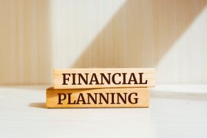 Wooden blocks with words 'FINANCIAL PLANNING'.